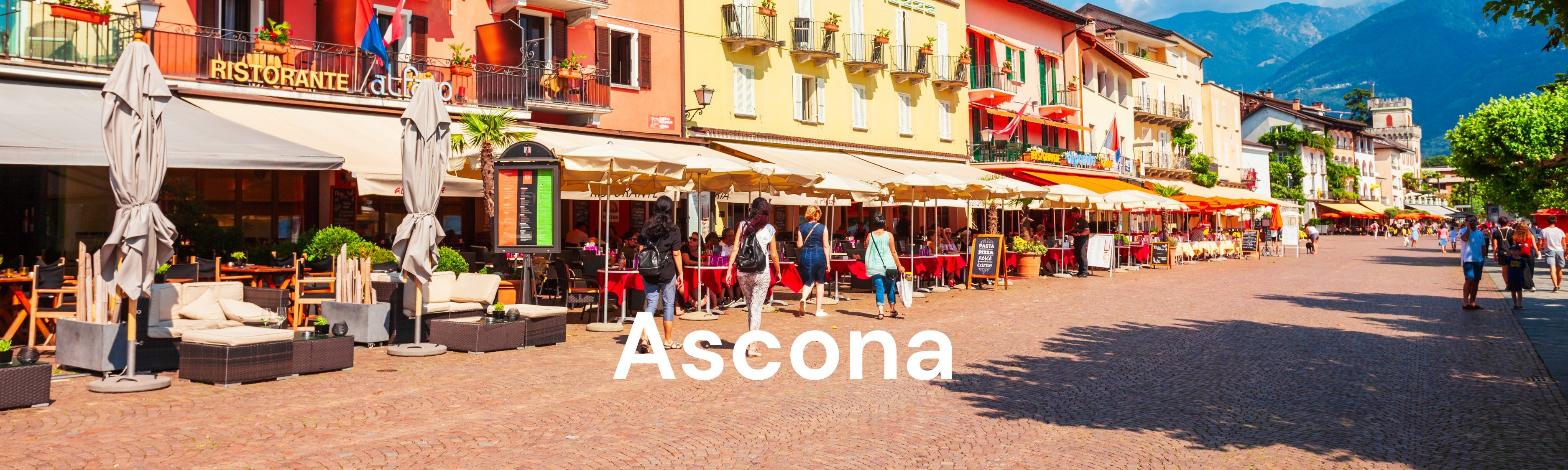 Ferien in Ascona am Lago Maggiore: Entspanntes Fahren an der Seepromenade mit dem Fischer City E-Bike Cita, das durch seinen tiefen Einstieg maximalen Komfort bietet.